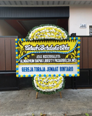 Papan Bunga Duka di Angkaisera